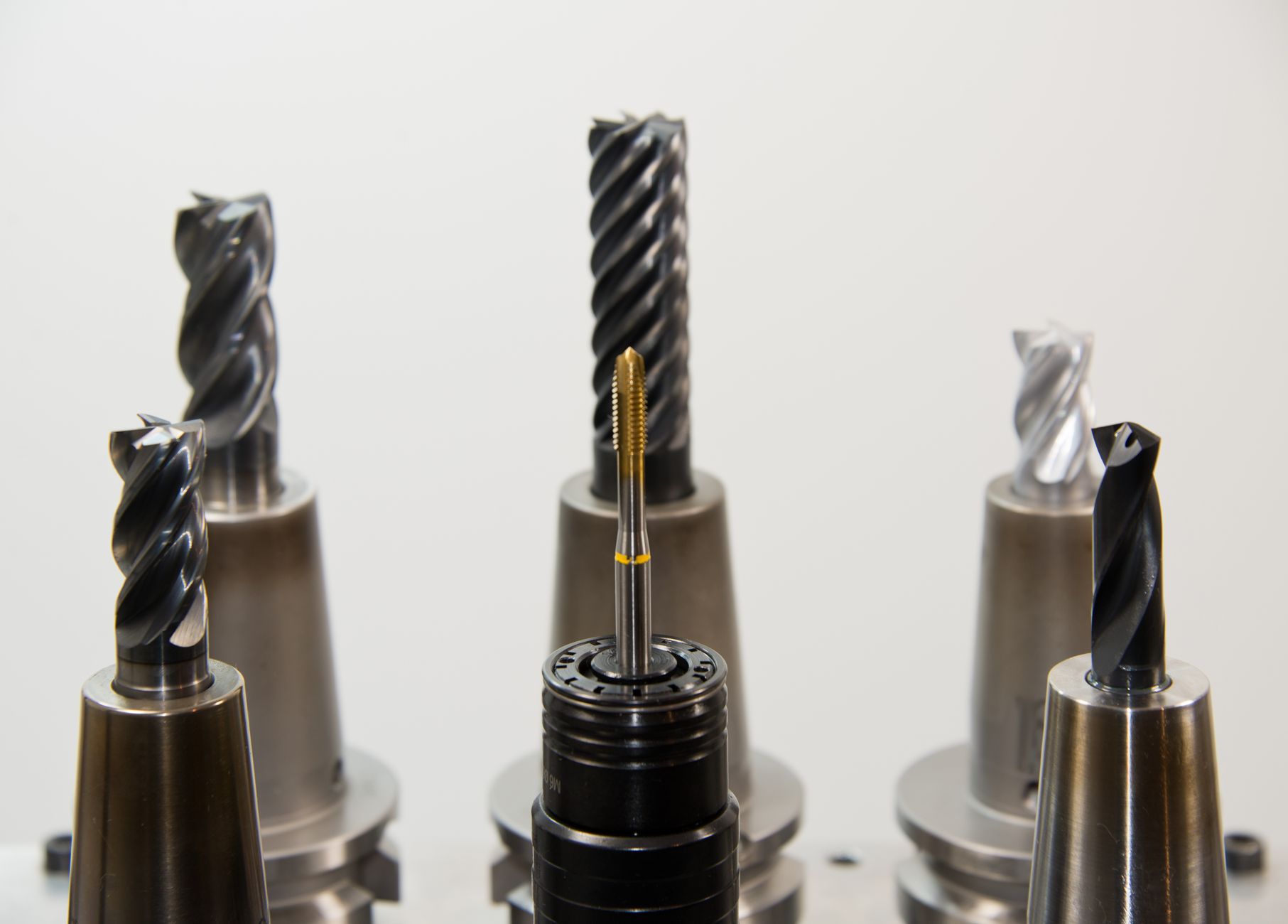A detailed view of different drill bits used in industrial machining applications.